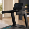 Touchscreen console and handrails on an incline treadmill