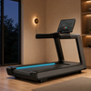 Wide-deck touchscreen treadmill in an evening home gym
