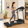 Woman walking on a compact folding treadmill at home
