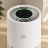 Close-up of the air purifier touch controls and top vent