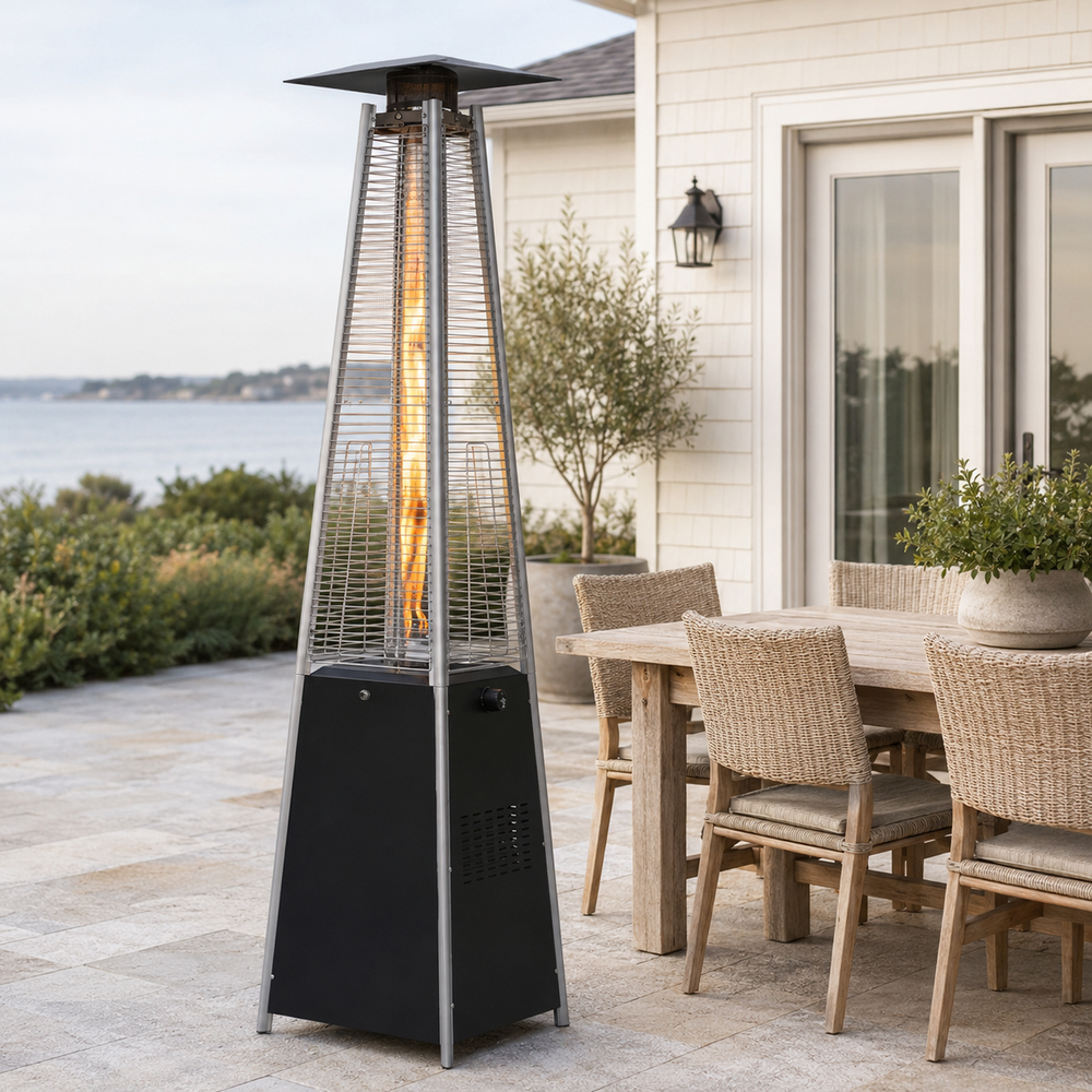 Black pyramid propane patio heater beside a coastal outdoor dining set