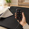 Corded sauna blanket controller showing adjustable temperature and timer settings